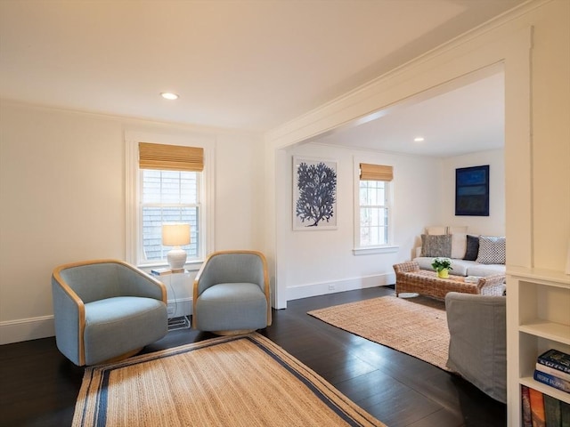 sitting room featuring recessed lighting, ornamental molding, baseboards, and wood finished floors