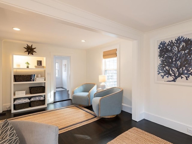 living room with recessed lighting, dark wood-style floors, baseboards, and ornamental molding