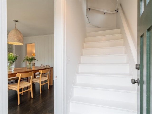 stairway with wood finished floors