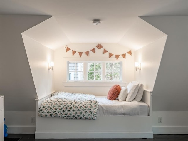 bedroom featuring lofted ceiling