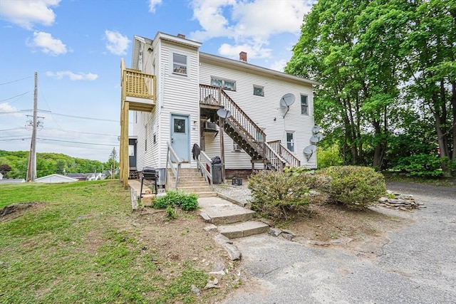 34 Worcester Rd, Charlton, MA 01507 - view of property featuring stairs and a chimney