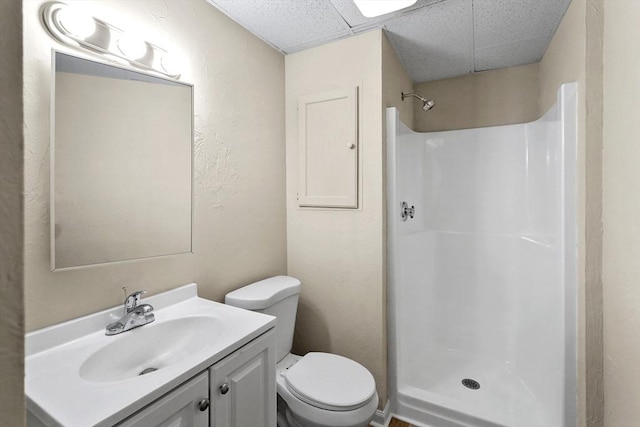 34 Worcester Rd, Charlton, MA 01507 - full bathroom with a shower, vanity, toilet, a paneled ceiling, and a textured wall