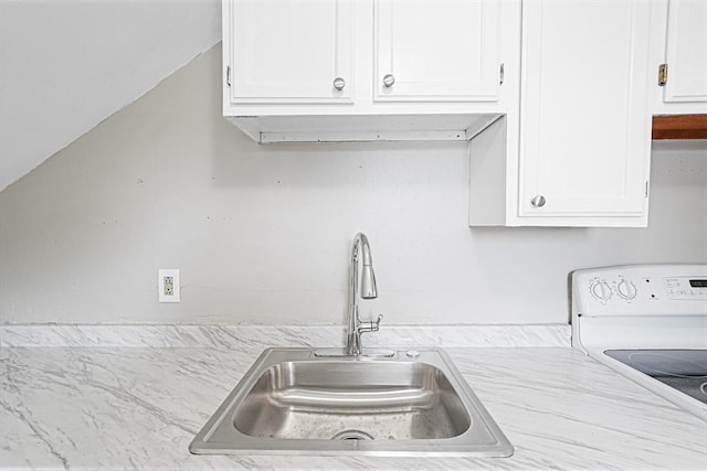 34 Worcester Rd, Charlton, MA 01507 - kitchen featuring a sink, stove, and white cabinets