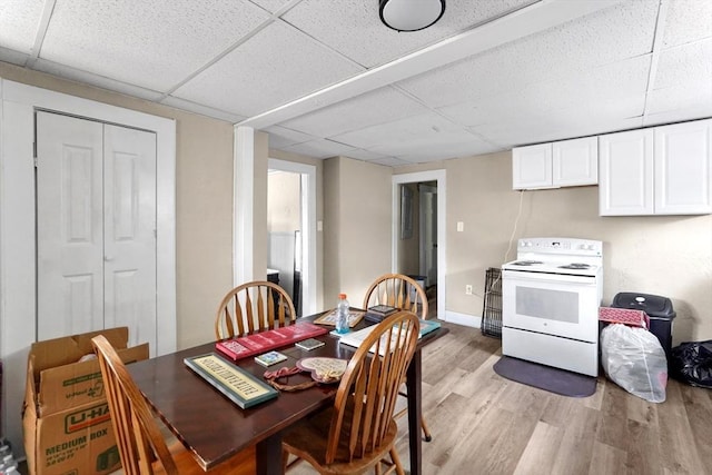 34 Worcester Rd, Charlton, MA 01507 - dining room with a paneled ceiling, light wood-style floors, and baseboards