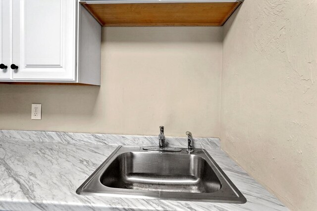 34 Worcester Rd, Charlton, MA 01507 - kitchen view of a sink, white cabinets, and light countertops