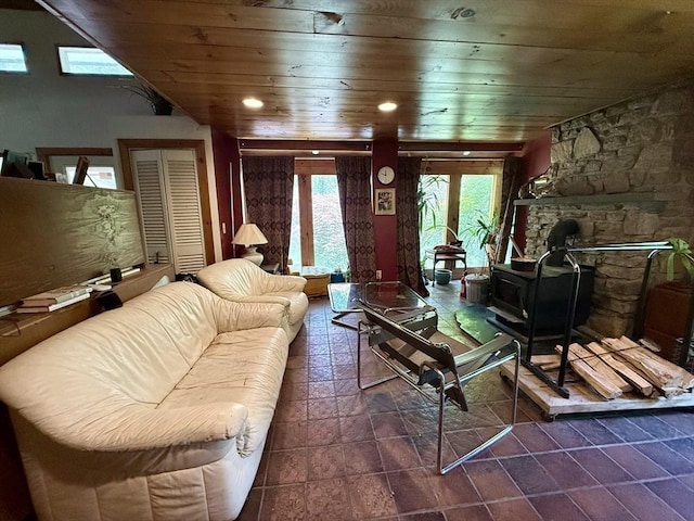 23 Partridge Hill Rd, Dudley, MA 01571 - living room with wood ceiling, a wood stove, and dark stone finish flooring