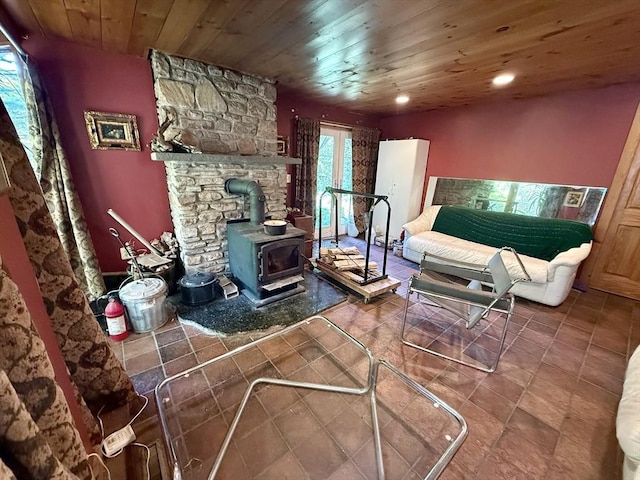 23 Partridge Hill Rd, Dudley, MA 01571 - living area with a wood stove, wooden ceiling, recessed lighting, and tile patterned floors
