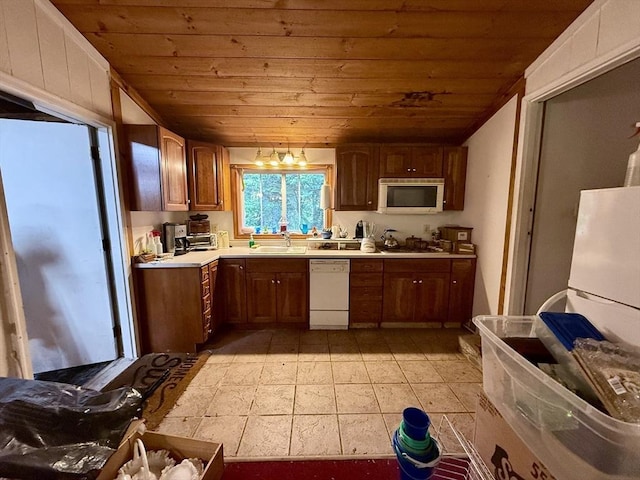 23 Partridge Hill Rd, Dudley, MA 01571 - kitchen featuring white dishwasher, wooden ceiling, light countertops, brown cabinets, and cooktop