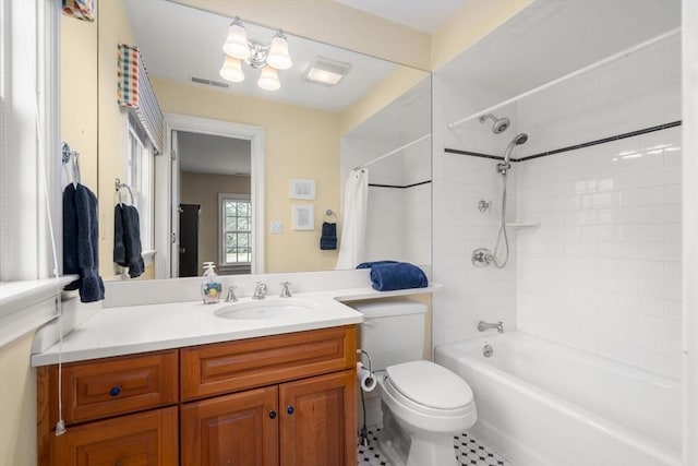 bathroom with visible vents, toilet, vanity, and shower / bath combination with curtain