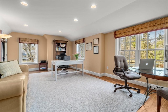 home office featuring recessed lighting, baseboards, lofted ceiling, and wood finished floors