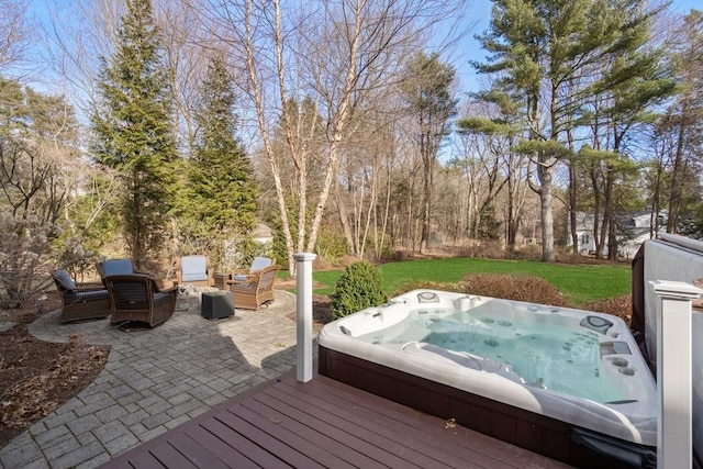 wooden deck featuring a patio area, a yard, and an outdoor hot tub