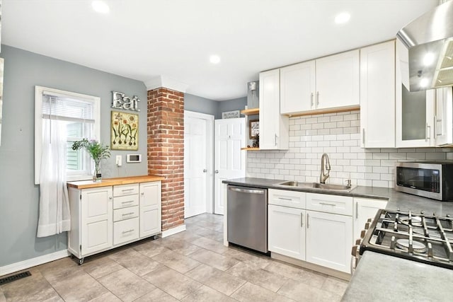 52 Harvard St, Chicopee, MA 01020 - kitchen featuring stainless steel appliances, a sink, white cabinetry, tasteful backsplash, and recessed lighting