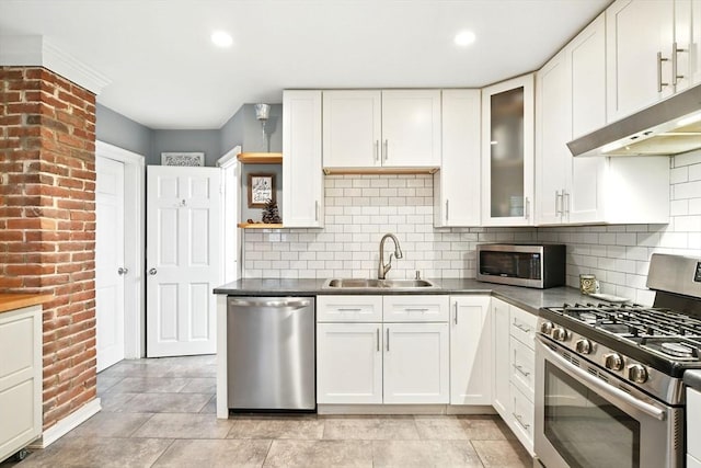52 Harvard St, Chicopee, MA 01020 - kitchen with stainless steel appliances, a sink, under cabinet range hood, open shelves, and white cabinetry