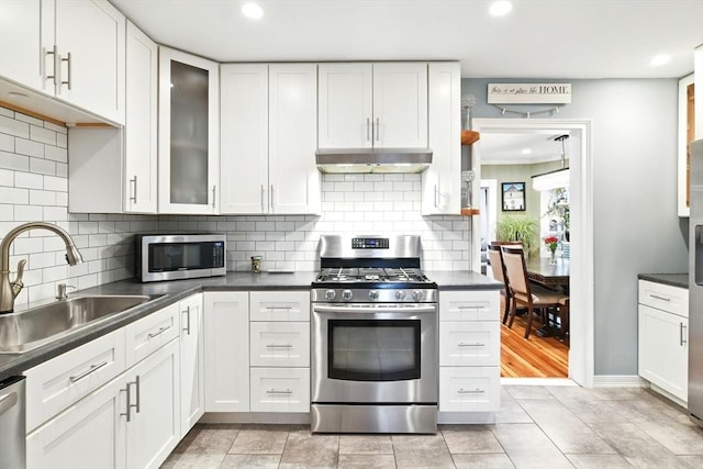 52 Harvard St, Chicopee, MA 01020 - kitchen featuring stainless steel appliances, a sink, under cabinet range hood, white cabinets, and recessed lighting