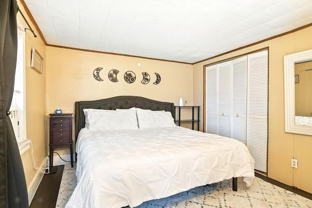 52 Harvard St, Chicopee, MA 01020 - bedroom featuring ornamental molding, a closet, wood finished floors, and baseboards