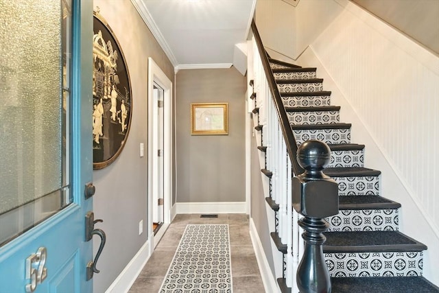 52 Harvard St, Chicopee, MA 01020 - foyer with ornamental molding, stairway, baseboards, and tile patterned floors