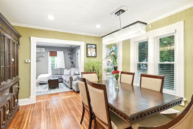 52 Harvard St, Chicopee, MA 01020 - dining area with light wood finished floors, a chandelier, ornamental molding, baseboards, and recessed lighting