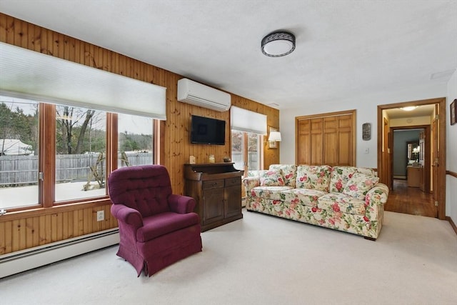 carpeted living area with baseboard heating, wood walls, and a wall unit AC