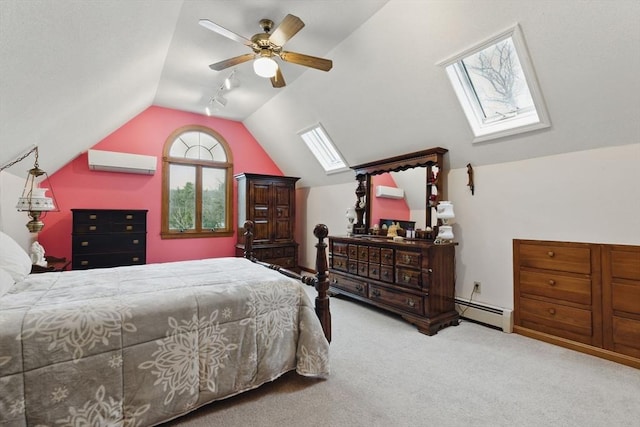 carpeted bedroom with a wall mounted air conditioner, a baseboard heating unit, vaulted ceiling with skylight, and a ceiling fan