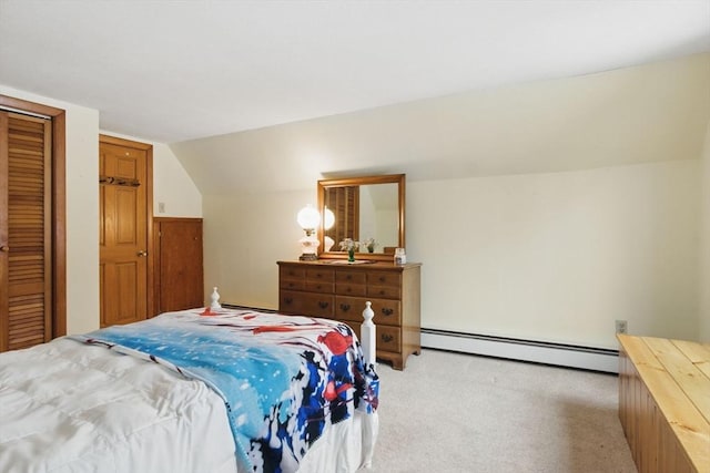 bedroom featuring a baseboard heating unit, lofted ceiling, light colored carpet, and a closet