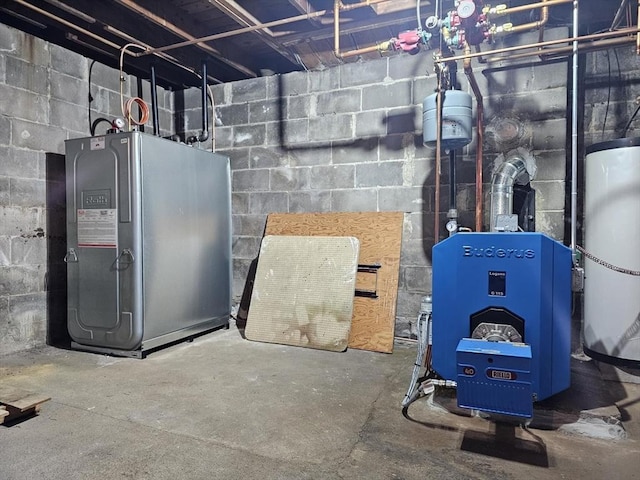 utility room featuring water heater and a heating unit