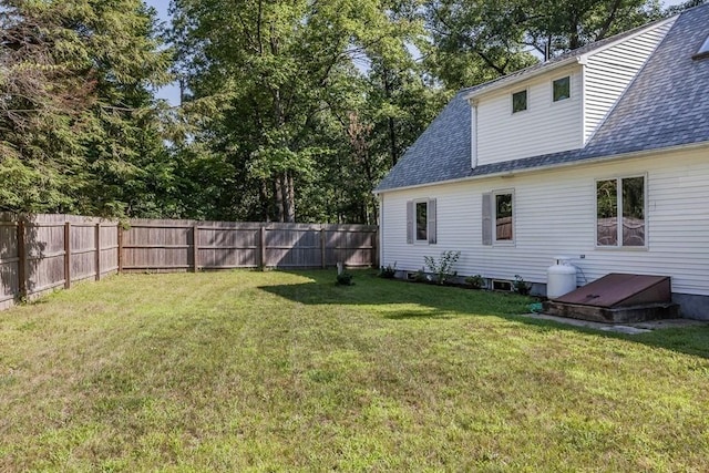 view of yard with a fenced backyard