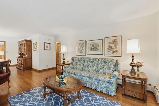 living room with baseboards and wood-type flooring