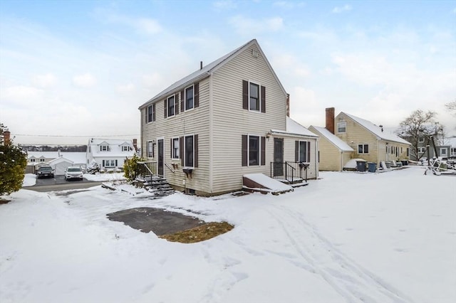 view of snow covered house