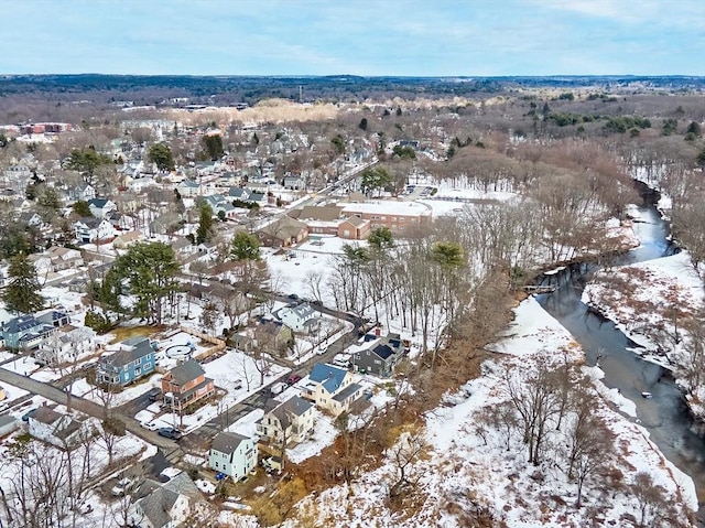 snowy aerial view with a residential view