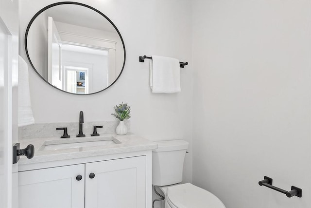 bathroom with vanity and toilet