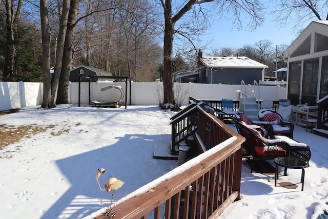 view of snow covered deck