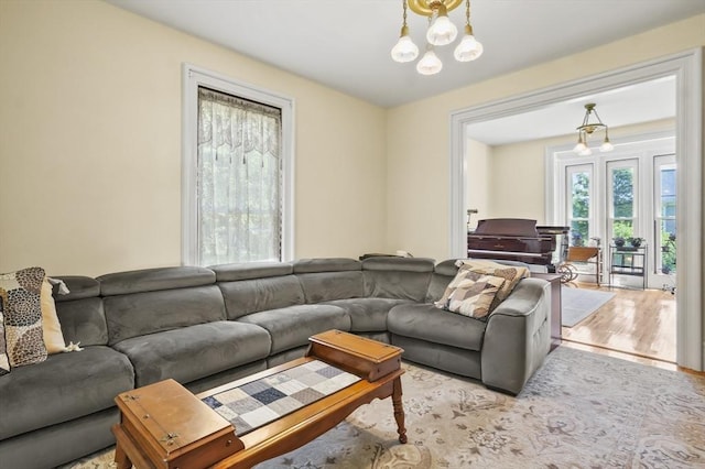 33 Grove St, Merrimac, MA 01860 - living area with wood finished floors and a chandelier