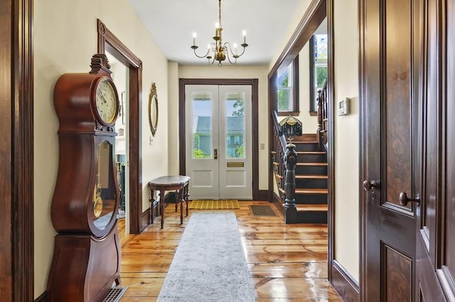 33 Grove St, Merrimac, MA 01860 - entrance foyer featuring a chandelier, light wood-style floors, and stairs