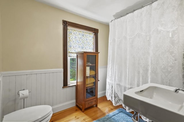 33 Grove St, Merrimac, MA 01860 - full bathroom featuring wood finished floors, a wainscoted wall, and healthy amount of natural light