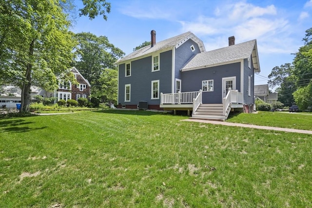33 Grove St, Merrimac, MA 01860 - rear view of property with a chimney, a lawn, a deck, and a shingled roof