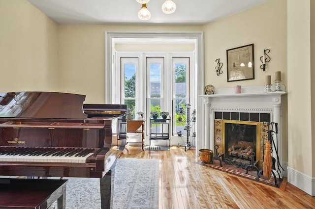33 Grove St, Merrimac, MA 01860 - sitting room featuring a tiled fireplace and hardwood / wood-style floors