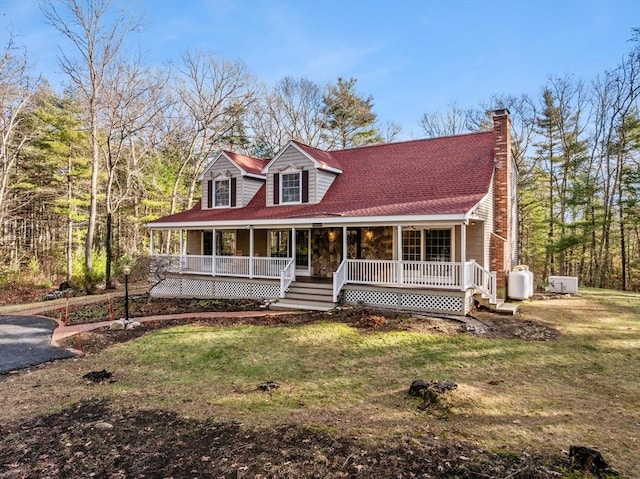 view of front facade with covered porch and a front yard