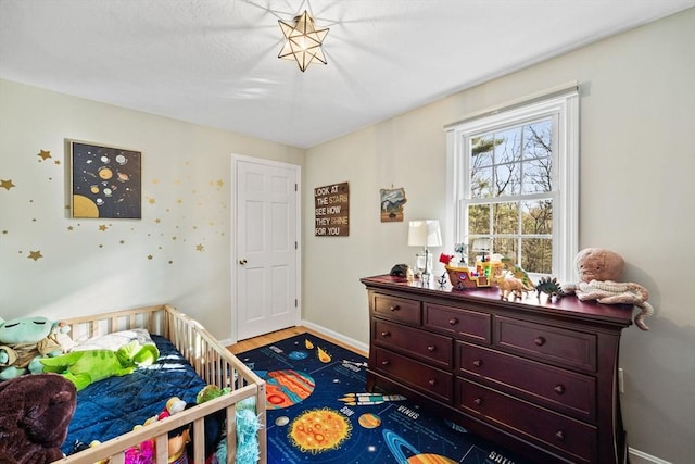 bedroom with hardwood / wood-style flooring