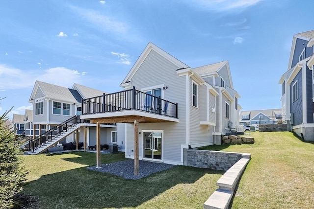 13 Birkdale Ln Unit 13, Hopkinton, MA 01748 - back of house with a deck, a lawn, a residential view, and stairs