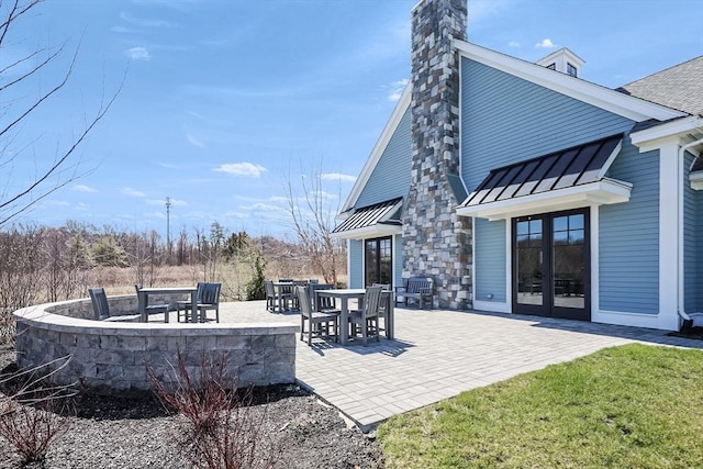 13 Birkdale Ln Unit 13, Hopkinton, MA 01748 - view of patio / terrace with french doors and a fire pit