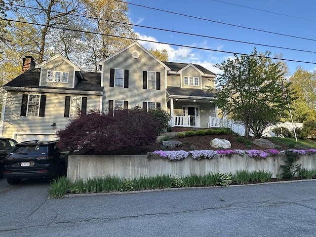 5 Lake Boon Dr, Hudson, MA 01749 - traditional home with a chimney and covered porch