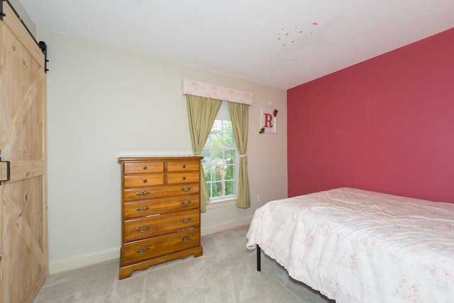 5 Lake Boon Dr, Hudson, MA 01749 - bedroom with a barn door, carpet, and baseboards