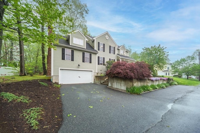 5 Lake Boon Dr, Hudson, MA 01749 - view of front facade featuring asphalt driveway and a garage