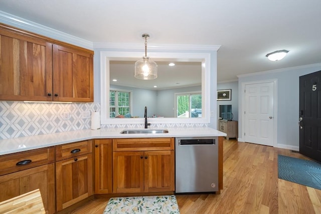 5 Lake Boon Dr, Hudson, MA 01749 - kitchen with dishwasher, a sink, brown cabinetry, light wood-type flooring, and crown molding