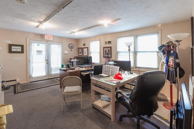 office area with french doors, track lighting, a textured ceiling, and a baseboard heating unit