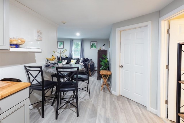 dining space with light wood-type flooring