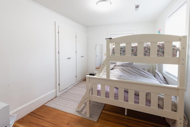 bedroom with hardwood / wood-style floors