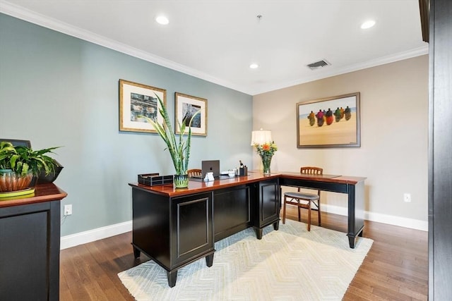 home office with recessed lighting, visible vents, ornamental molding, wood finished floors, and baseboards