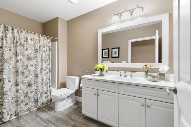 bathroom with toilet and vanity