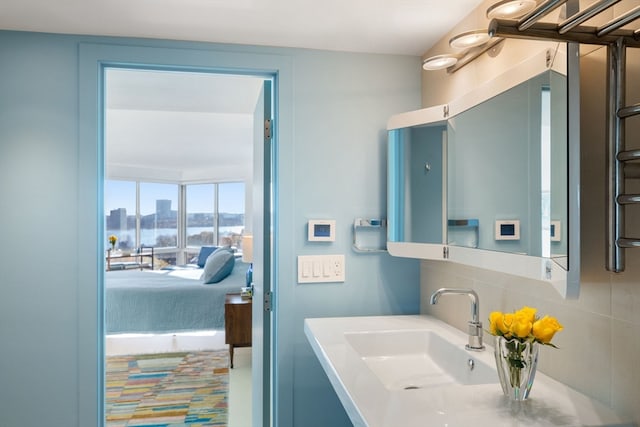 bathroom with vanity and backsplash